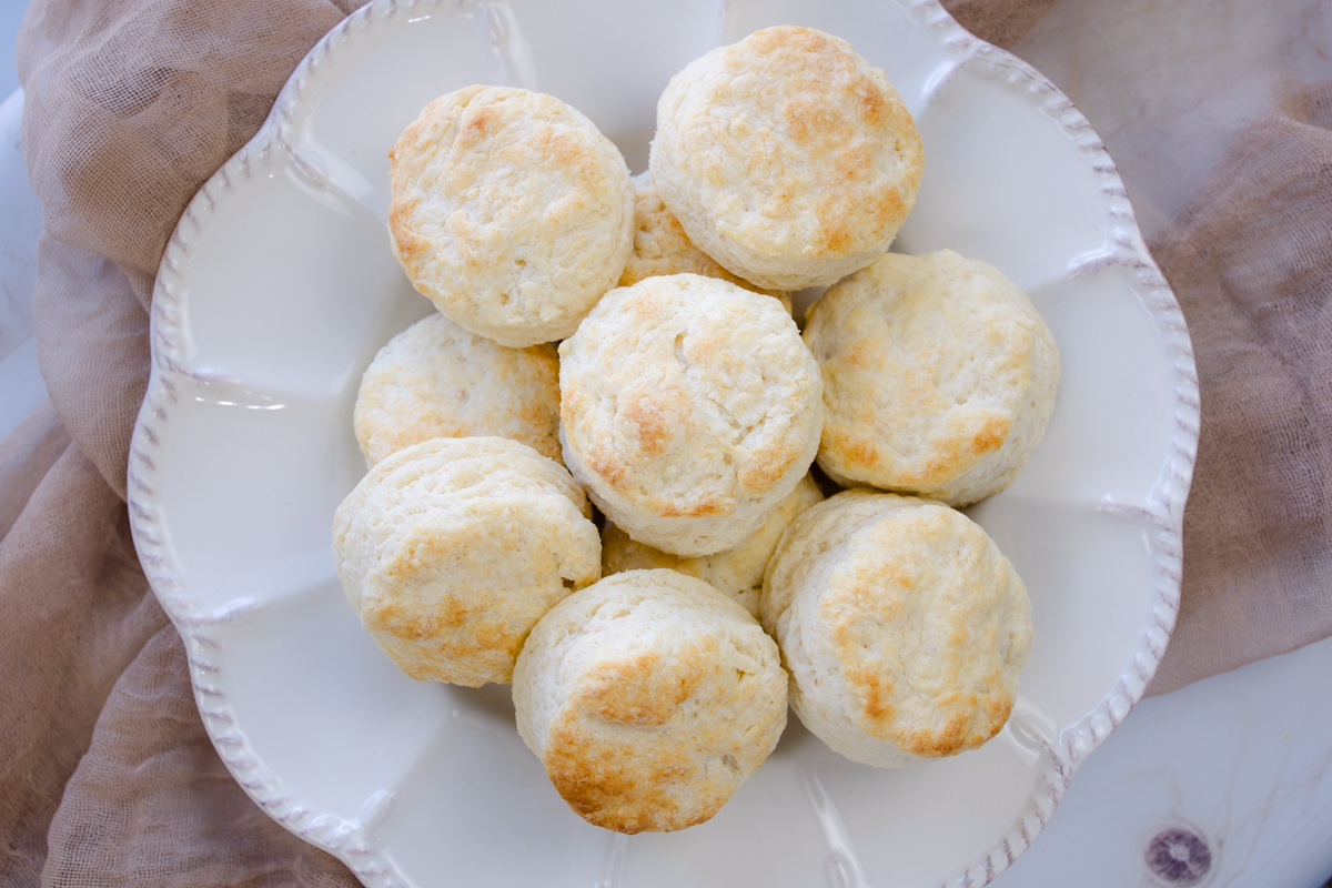 Overhead view of Buttermilk Biscuits on a white serving platter.