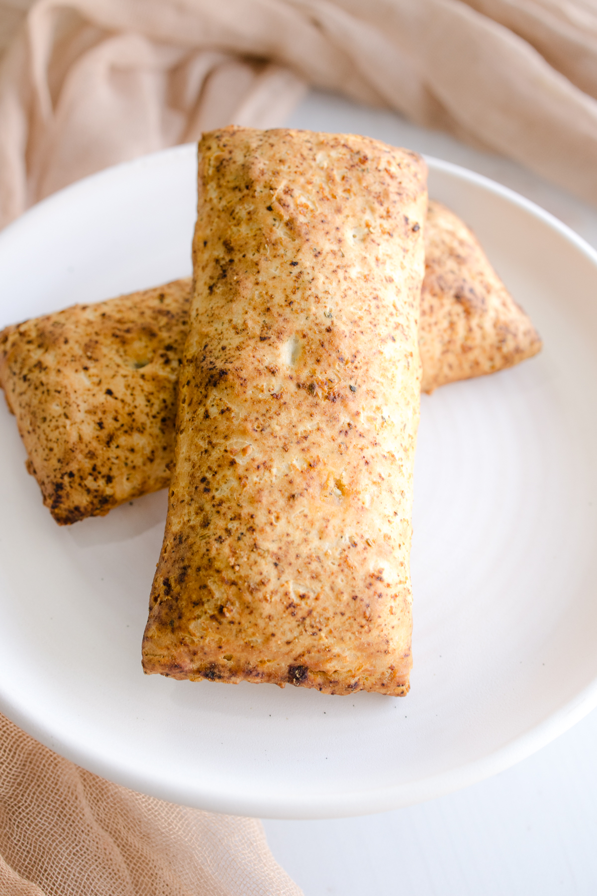 Angled view of one hotpocket stacked on top of another.