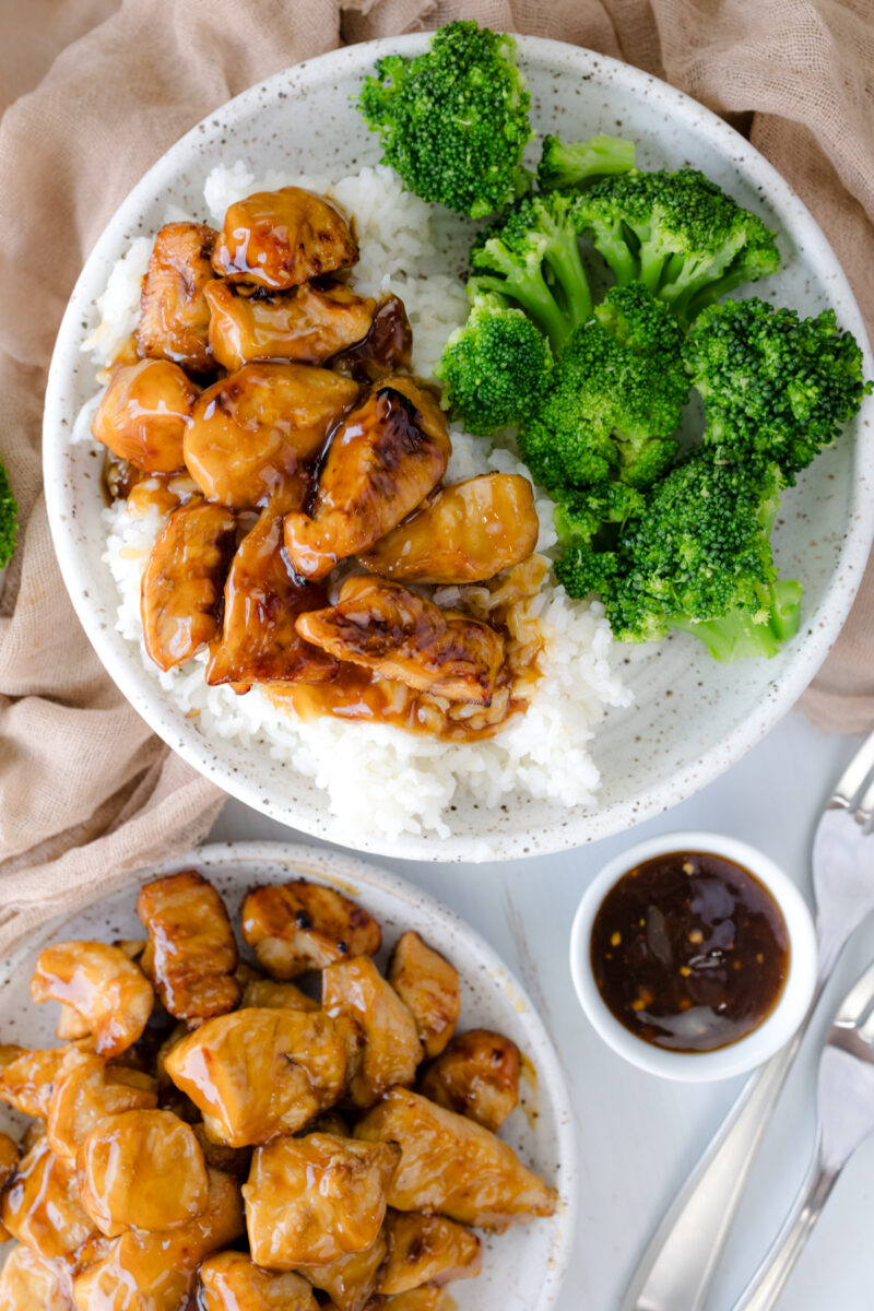 Overhead image of Air Fryer Teriyaki Chicken on a white plate with rice and broccoli.
