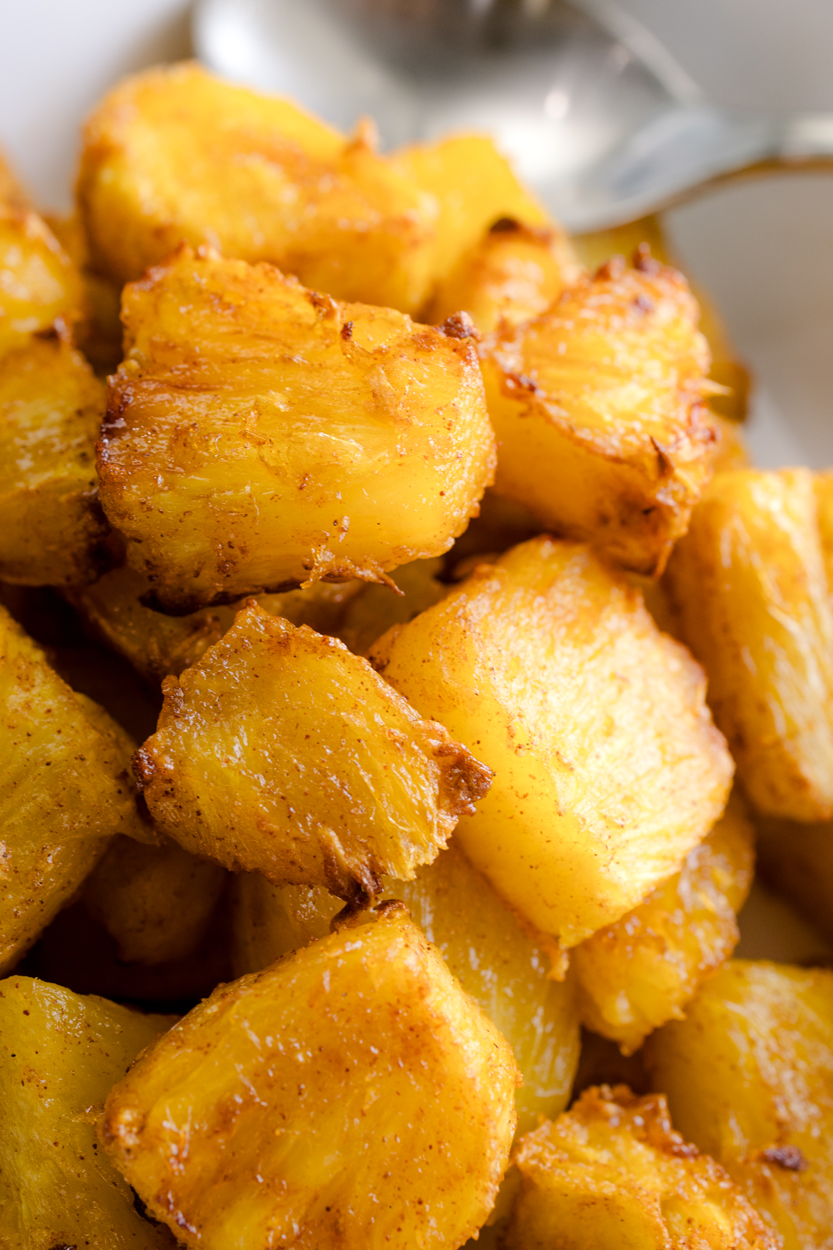 Close up view of Air Fryer Pineapple in a square, white dish.