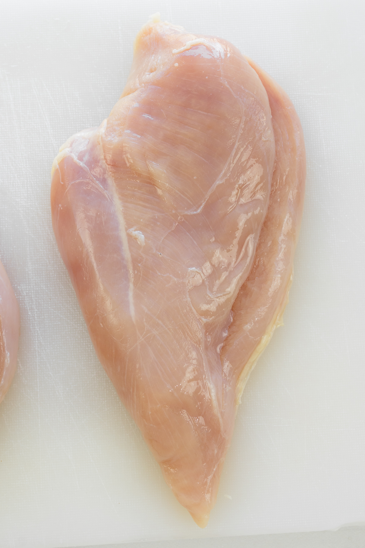 Close up overhead view of a sliced chicken breast.