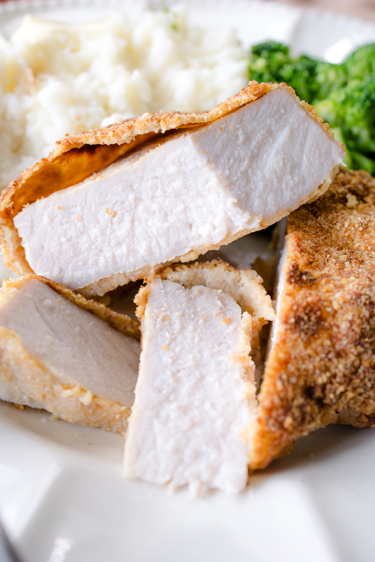 Close-up of crispy air fryer breaded pork chops ready for dinner tonight.
